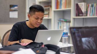 Student working at laptop